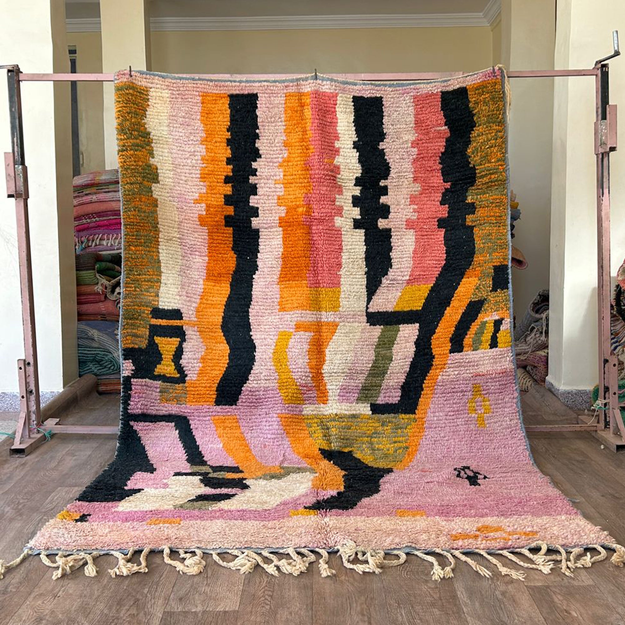 Handmade Moroccan Wool Rug – Abstract Berber Design in Pink, Orange, and Black, Boho Chic Area Carpet with Tassels, Unique Home Decor